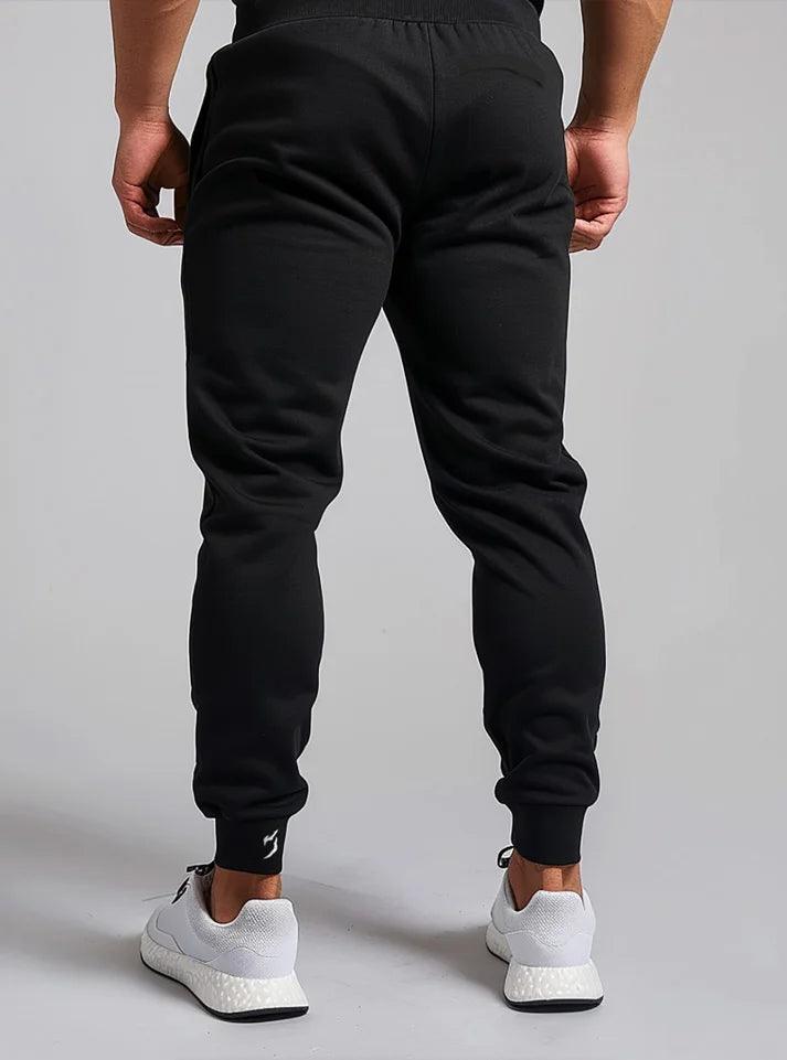 Pre-shrunk, loose-fit jog pants perfect for both gym training and outdoor activities, featuring a powerfull design