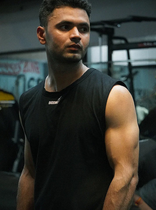 an gym athlete wearing black sleeveless vest from Radowl Gym wear brand and the product name of this vest is "Radowl Black Gym Vest"