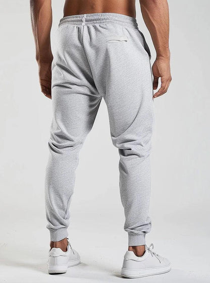 Comfortable trousers for men, a men wearing stylish gym lower featuring its perk a best lower for every kind of workout.